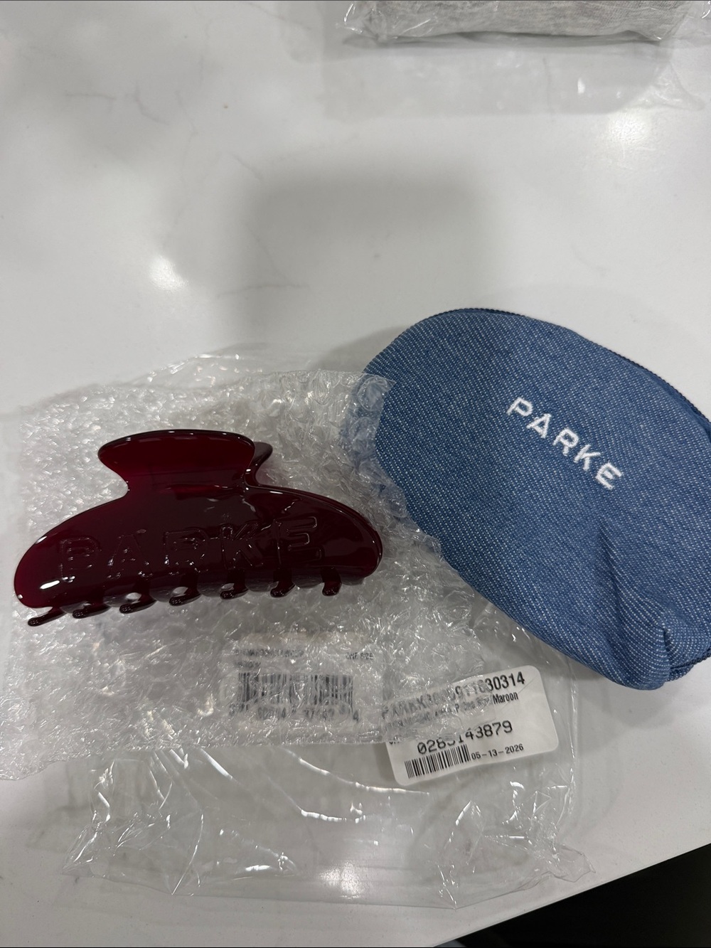 New in bag Parke Maroon Hair Claw Clip with Denim Case